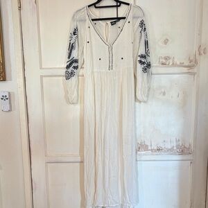 Elegant Cream Long Sleeve Dress with Black Embroidery